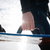 WOO Big Air Handle impugnato su un kiteboard durante una sessione — grip composito nero con alloggio sensore integrato